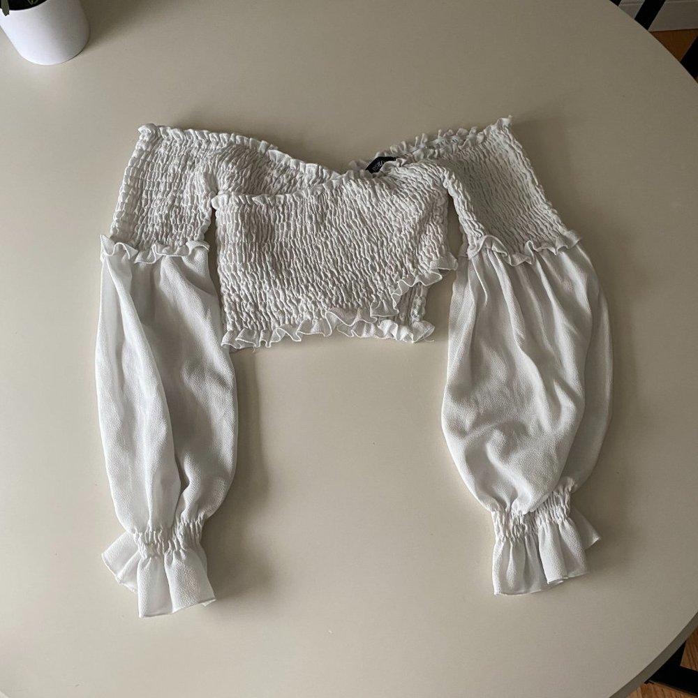 White, smocked crossed long sleeve crop top